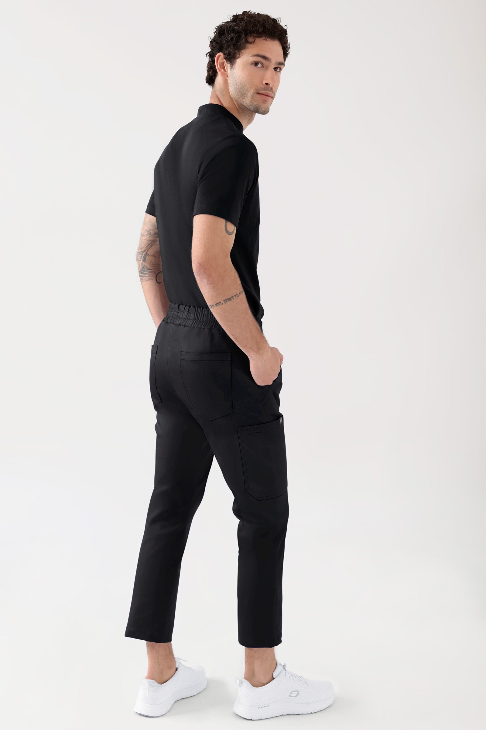 COMFY FLEX Stretch Hose Unisex - 7/8 Länge schwarz, Vue de dos Le mannequin mesure 188 cm et porte la taille M